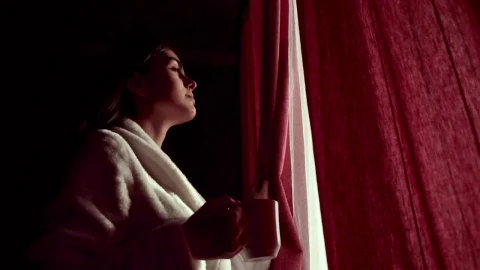 Stock Footage Woman Sips Coffee And Looks Through Curtains In Lockdown Live Wallpaper Free - Free Live Wallpaper