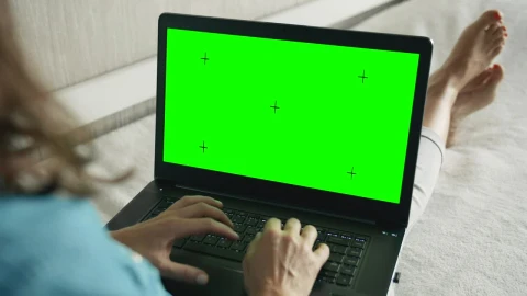 Stock Footage Woman Types On Greenscreen Laptop On Sofa Live Wallpaper Free - Free Live Wallpaper