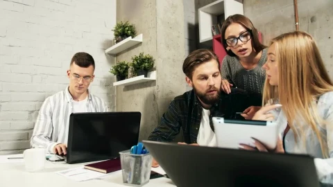 Stock Footage Young Team Brainstorms Ideas While Working In Modern Office Live Wallpaper Free - Free Live Wallpaper