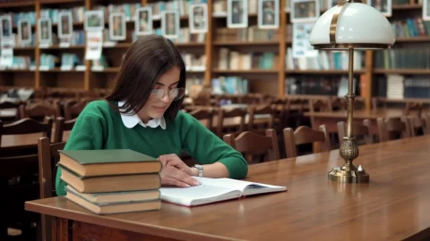 Stock Footage Young Woman Learning In Library Smiles At Camera Live Wallpaper Free - Free Live Wallpaper