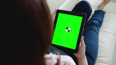 Stock Footage Woman Looks At Website With Chroma Key Tablet On Sofa Live Wallpaper Free - Free Live Wallpaper