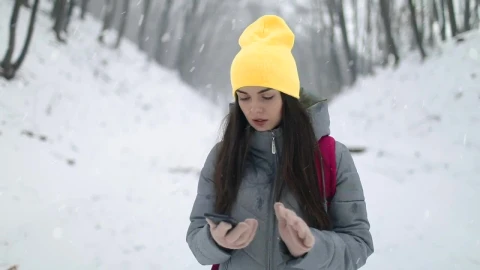 Stock Footage Woman On Winter Hike Uses App On Mobile Phone Live Wallpaper Free - Free Live Wallpaper