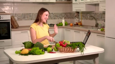 Stock Footage Woman Prepares Dinner While Video Chatting On Laptop Live Wallpaper Free - Free Live Wallpaper