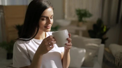 Stock Footage Woman Enjoys Cup Of Coffee And Smiles Live Wallpaper Free - Free Live Wallpaper
