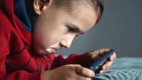 Stock Footage Young Boy Playing Mobile Video Games On Bed Live Wallpaper Free - Free Live Wallpaper