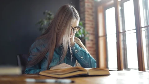 Stock Footage Young Student Reading A Book In Sunlit Room Live Wallpaper Free - Free Live Wallpaper