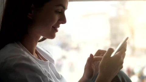 Stock Footage Woman Smiles While Using Mobile App Live Wallpaper Free - Free Live Wallpaper
