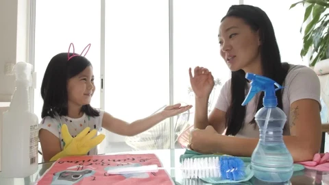 Stock Footage Young Mother Putting Cleaning Gloves On Her Daughter Live Wallpaper Free - Free Live Wallpaper