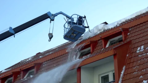 Stock Footage Worker Removing Snow On The Roof Of The Building Live Wallpaper Free - Free Live Wallpaper