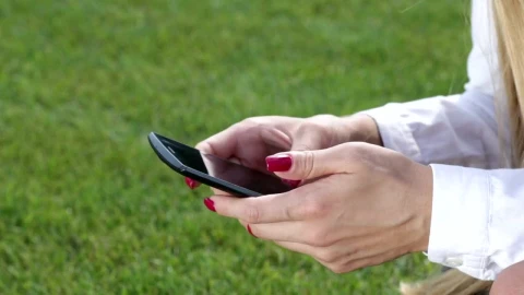 Stock Footage Woman Scrolling Through Her Phone Live Wallpaper Free - Free Live Wallpaper