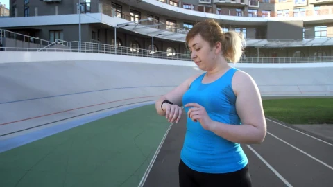 Stock Footage Woman Using A Fitness Gadget Live Wallpaper Free - Free Live Wallpaper