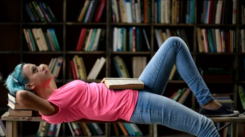 Stock Footage Woman Laying Down With Her Books Live Wallpaper Free - Free Live Wallpaper