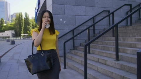 Stock Footage Woman Drinking Coffee While Walking To Work Live Wallpaper Free - Free Live Wallpaper
