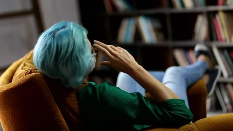 Stock Footage Woman Relaxing In The Library Live Wallpaper Free - Free Live Wallpaper