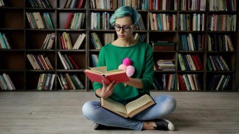 Stock Footage Woman With Glasses Reading In The Library Live Wallpaper Free - Free Live Wallpaper