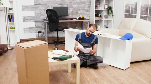 Stock Footage Young Man Trying To Build A Bookcase Live Wallpaper Free - Free Live Wallpaper