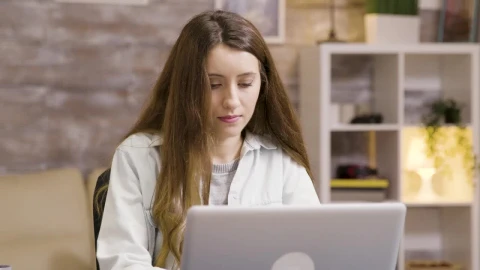Stock Footage Young Woman Sips Coffee While Working From Home Live Wallpaper Free - Free Live Wallpaper