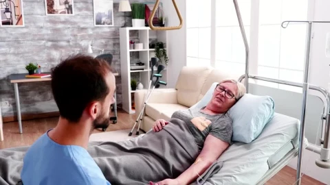 Stock Footage Woman In Hospital Bed Comforted By Nurse Live Wallpaper Free - Free Live Wallpaper
