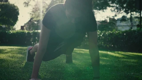 Stock Footage Young Woman Doing Push Ups On The Grass In A Park Live Wallpaper Free - Free Live Wallpaper
