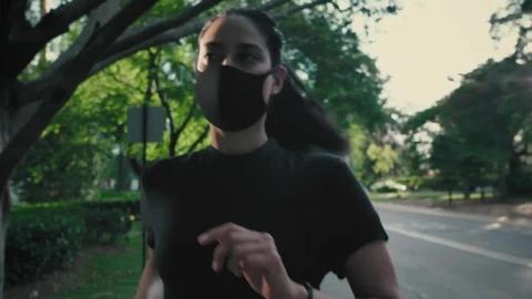 Stock Footage Young Woman Running With Mask On The Street Live Wallpaper Free - Free Live Wallpaper