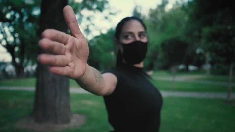 Stock Footage Woman With Face Mask Stretching With Her Arms In A Live Wallpaper Free - Free Live Wallpaper