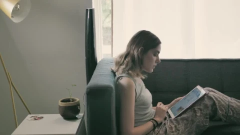 Stock Footage Young Woman On Her Ipad Lying On An Armchair Live Wallpaper Free - Free Live Wallpaper