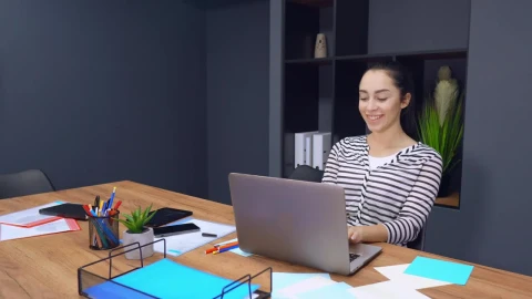Stock Footage Young Female Employee Having A Video Call With A Client Live Wallpaper Free - Free Live Wallpaper