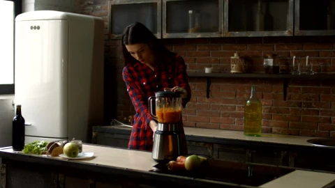 Stock Footage Young Woman Preparing A Smoothie In A Kitchen Live Wallpaper Free - Free Live Wallpaper