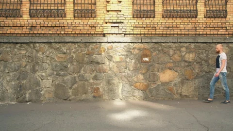 Stock Footage Young Bearded Man Walking Down The Street Live Wallpaper Free - Free Live Wallpaper
