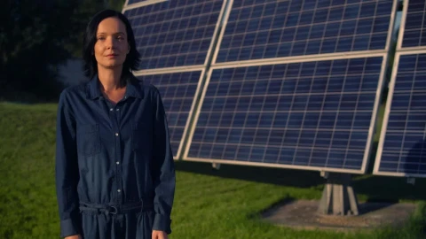 Stock Footage Woman Standing In Front Of A Solar Panel Live Wallpaper Free - Free Live Wallpaper