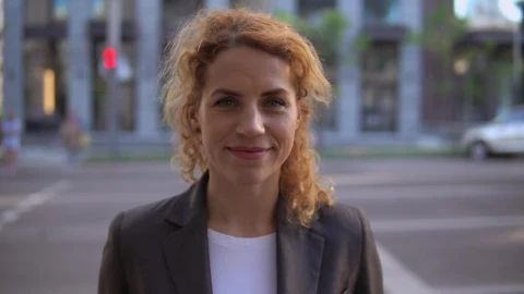 Stock Footage Woman In Blazer On The Street Smiling In The Foreground Live Wallpaper Free - Free Live Wallpaper