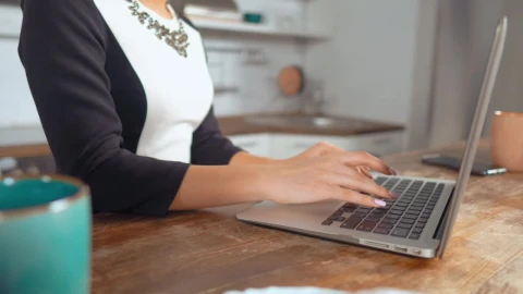 Stock Footage Woman Working On A Computer In A Kitchen Live Wallpaper Free - Free Live Wallpaper