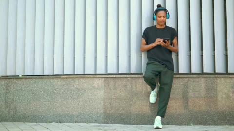 Stock Footage Young Man Snaps His Fingers Listening To Music Live Wallpaper Free - Free Live Wallpaper