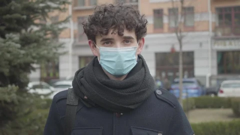 Stock Footage Young Man With Face Mask On The Street Live Wallpaper Free - Free Live Wallpaper
