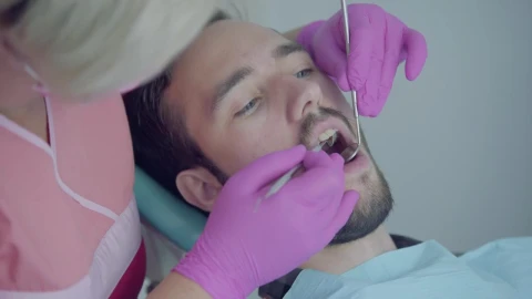 Stock Footage Young Man In Consultation With The Dentist Live Wallpaper Free - Free Live Wallpaper