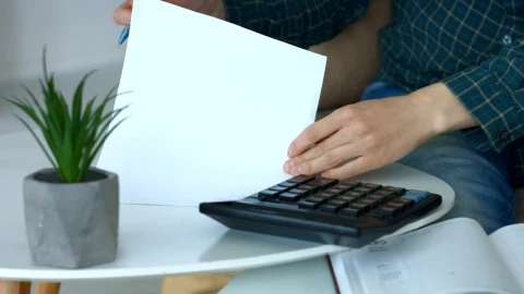 Stock Footage Woman Doing Accounts On A Calculator Live Wallpaper Free - Free Live Wallpaper