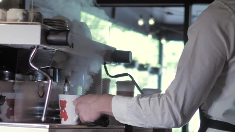 Stock Footage Young Man Serving Hot Coffee Into A Cup Live Wallpaper Free - Free Live Wallpaper