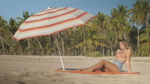 Stock Footage Young Woman Sunbathing On The Beach Live Wallpaper Free - Free Live Wallpaper