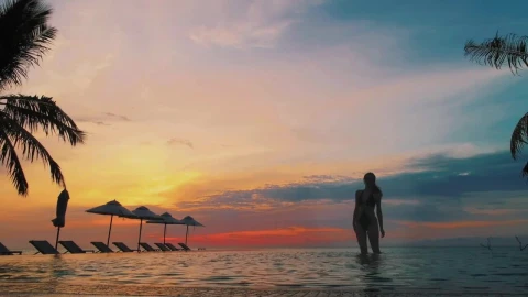 Stock Footage Woman In An Infinity Pool At Sunset Live Wallpaper Free - Free Live Wallpaper