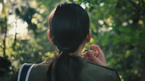 Stock Footage Woman Form Behind Puts On Headphones Live Wallpaper Free - Free Live Wallpaper