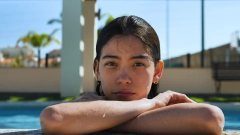 Stock Footage Woman Lounging On The Edge Of The Pool Live Wallpaper Free - Free Live Wallpaper