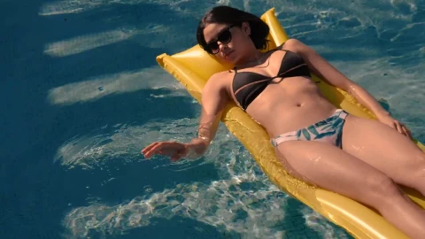 Stock Footage Woman Sunbathing In The Swimming Pool Live Wallpaper Free - Free Live Wallpaper