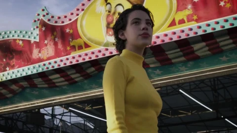 Stock Footage Woman Walking In Front Of Mechanical Rides Live Wallpaper Free - Free Live Wallpaper