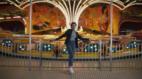 Stock Footage Woman Standing In Front Of Amusement Park Ride Live Wallpaper Free - Free Live Wallpaper
