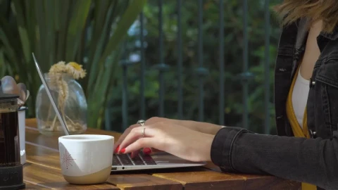 Stock Footage Woman Typing On Her Laptop In A Coffee Shop Live Wallpaper Free - Free Live Wallpaper