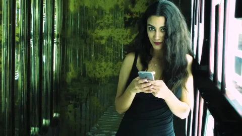 Stock Footage Woman Texting In A Club Entrance Live Wallpaper Free - Free Live Wallpaper