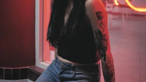 Stock Footage Woman With Tattoos In A Shop Window Live Wallpaper Free - Free Live Wallpaper