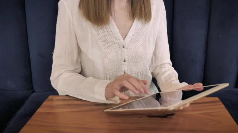 Stock Footage Woman Using A Tablet On The Couch Live Wallpaper Free - Free Live Wallpaper