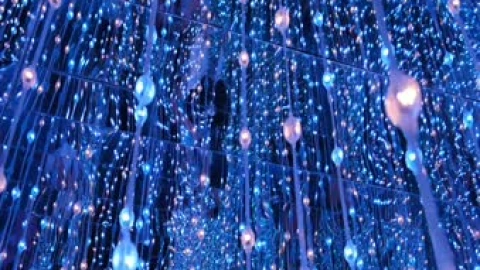 String Of Changing Color Lights Hanging From A Mirror Ceiling Live Wallpaper - Free Live Wallpaper